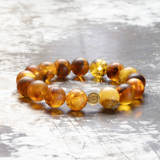 Matte amber bracelet with gold-plated logo coin